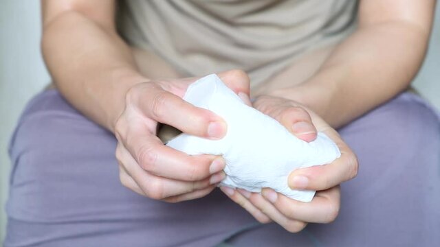 Man's hand, he holds a roll of toilet paper Going to the bathroom Toilet toilet background