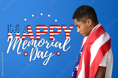Sad African-American teenage boy with national flag of USA on color background. Memorial Day celebration