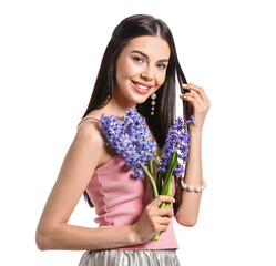 Beautiful young woman with hyacinth flowers on white background