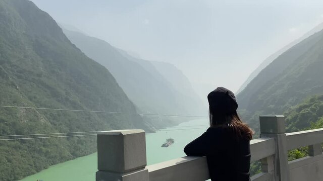 Women enjoying the scenery at Wujiang river viewing platform