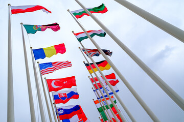 Flags of different countries on flagpoles
