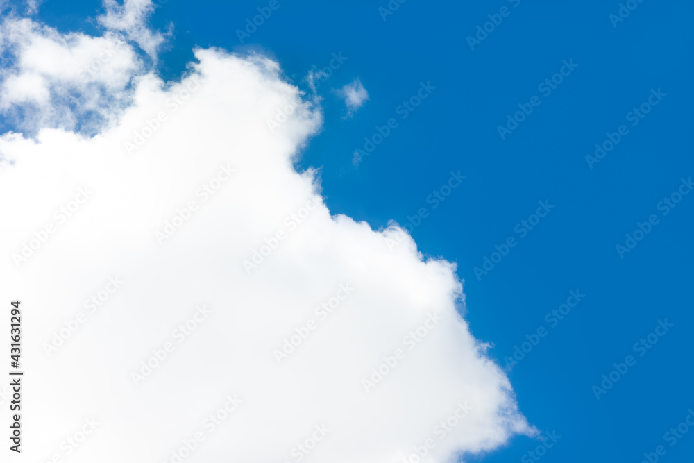 Wall mural pure white cloudscape scene with natural sunlight in summer. soft fluffy clouds floating over bright