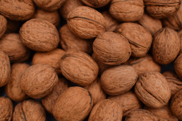 Whole walnuts and nutcracker background. Close up, top view. Harvest concept. High quality photo