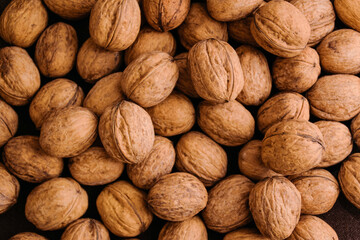 Natural walnut background pattern texture. Abstract walnuts heap pattern background