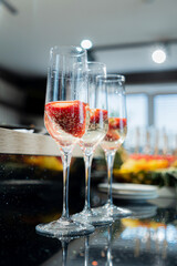 catering table with fizz and strawberries