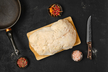Overhead view of lamb fat tail on kitchen table