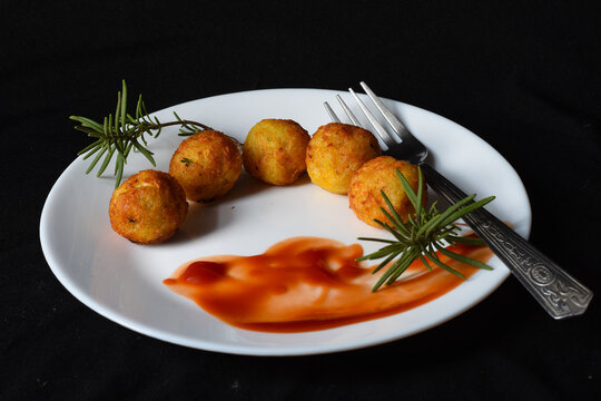 Tater Tots With Ketchup And Rosemary .