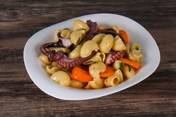 Pasta with octopus and yellow tomatoes