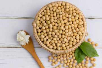 Soybean or soya bean in a bowl on white table background, healthy concept.