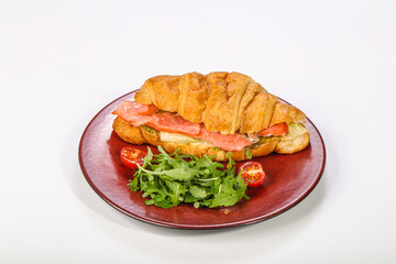 Croissant with salmon for breakfast