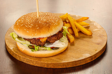 Burger with beef, vegetables and cheese