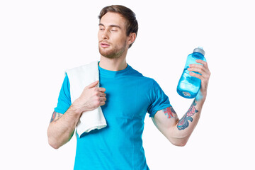 sport man with towel on shoulder water bottle energy health workout