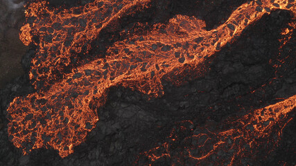 lava eruption volcano with snowy mountains, Aerial view
Hot lava and magma coming out of the...
