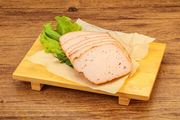 Boiled pork sausage over board