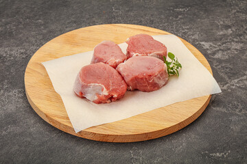 Raw pork medallion served rosemary