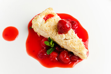 napoleon cake with cherry sauce and mint