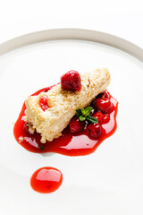 napoleon cake with cherry sauce and mint
