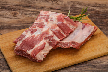 Raw pork ribs served rosemary