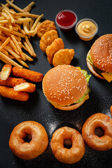 fast food on the black background