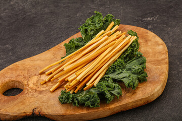 Chechel cheese sticks over board