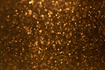 Gold bokeh blur defocus with black background