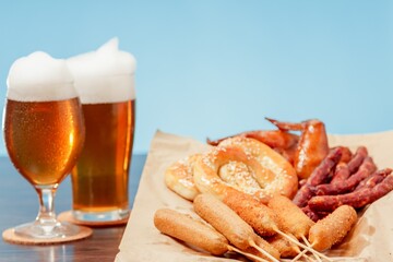Beer glass alcohol drink with food sausage,  meal pub.