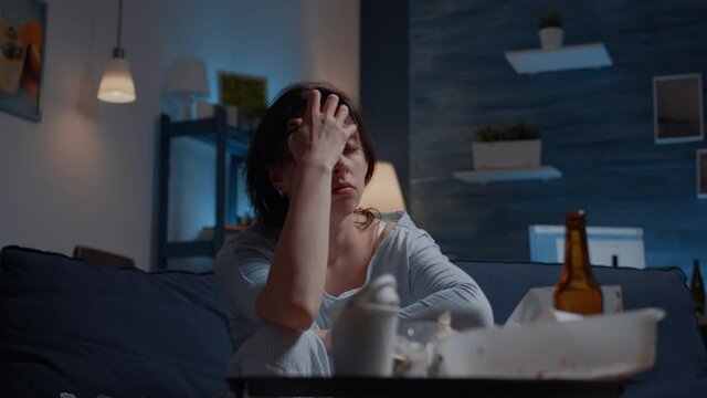 Sad depressed woman feeling headache fatigue loneliness, upset tired sick ill suffering from migraine anxiety. Stressed unhealthy lonely person having migraine, bipolar disorder, major depression