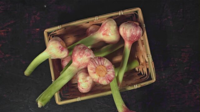 Super slow motion garlic falls into the basket.Filmed on a high-speed camera at 1000 fps. High quality FullHD footage