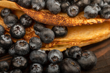 Fresh blueberries and traditional Russian pancakes. Shrovetide week of the end of winter.