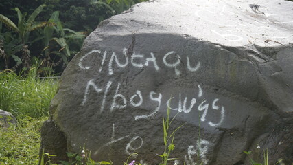 vandalism on the rock near the riverside