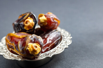Selective focus of dates in focus on gray background