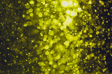 Gold bokeh of lights from water