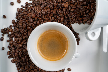 a cup of coffee, coffee beans