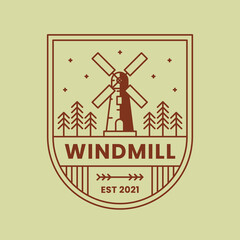 Windmill or windturbine logo with trees