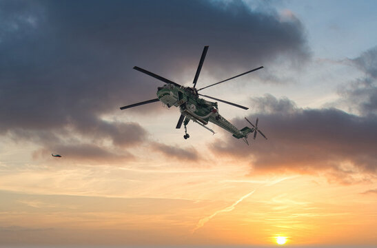 La Spezia, Italy - May 05, 2021: Erickson Air Crane helicopter (Sikorsky S-64) N243AC fly against different type of sky