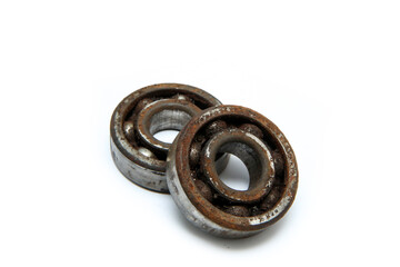 The rusty old bearings isolated in a white background. Jammed and unusable. 