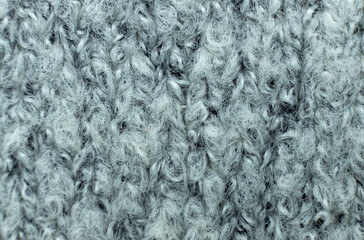 The gray background is made of natural fabric with a pattern. Fine texture of the fabric. Suitable for your text or logo. Top view. Copy space.