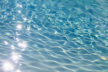 Photo for background material close up on the ripples of clear blue water shining in the sunlight