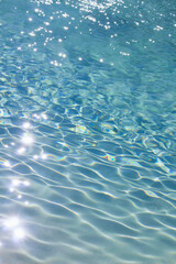 Photo for background material close up on the ripples of clear blue water shining in the sunlight