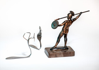 Achilles against two crooked forks on a white background