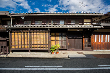 Traditional Japanese building architecture with green plant in historical Japanese old town of Takayama, Gifu, Japan.
