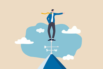 Business direction to achieve success, leadership and visionary concept, smart businessman standing on top of weather vanes on the roof pointing to winning direction.