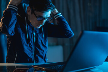 Cybercriminal hacker typing program code while stealing access databases with passwords. Concept of...