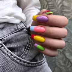 Bright multi-colored design of manicure.Multicolored manicure close up