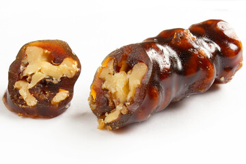 Walnuts on a string dipped in starch grape molasses. Churchkhela. Walnut sujuk.