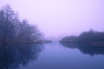 Lake view on a foggy autumn day.