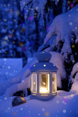 Christmas lantern and a toy under the tree. Christmas tree in the snow in the forest © vvlink