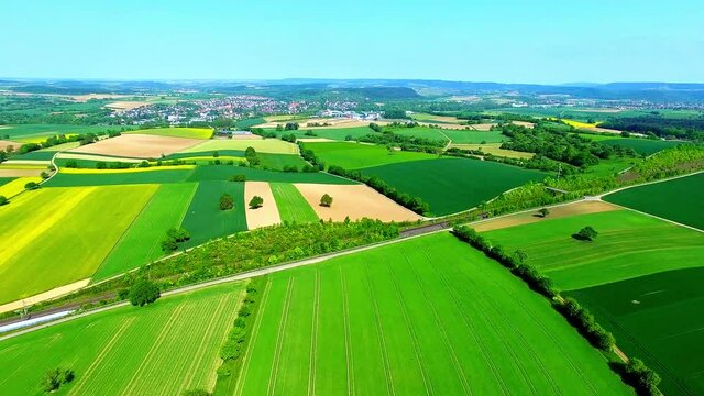 Aerial shot of the vast green farmland of Bauerbach, Germany