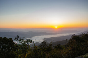 Naklejka premium Dawn of Sea Fog on the top of the Sierra Early morning at Doi Samer Dao, Nan, thailand