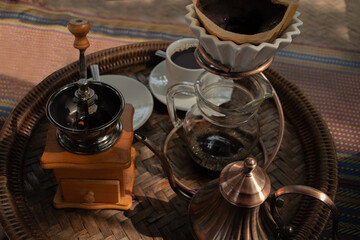 Coffee roaster and coffee set on a wicker tray